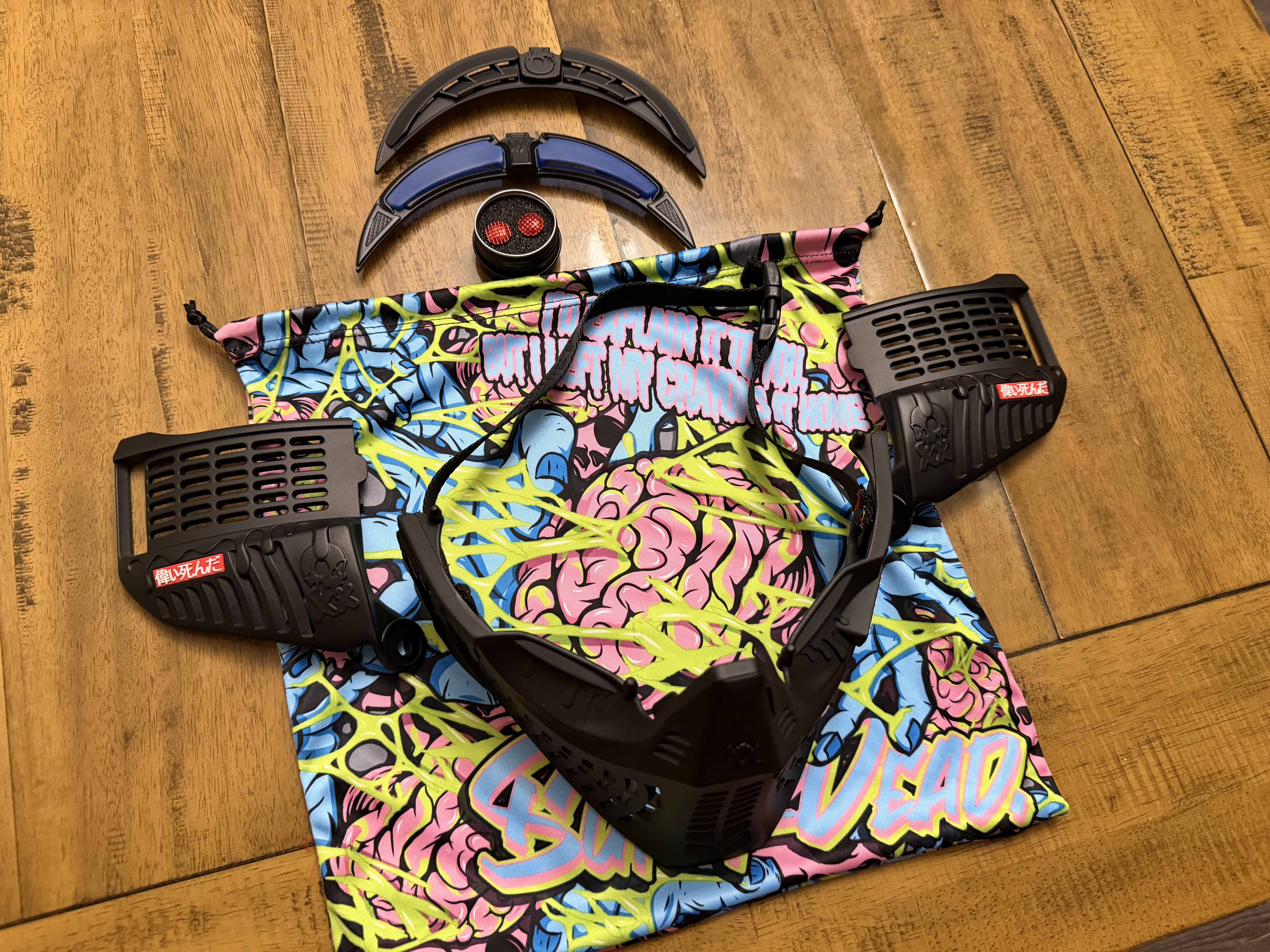Black subrazed bottoms/ ears/ rain lid / strap. And biscuit red plugs