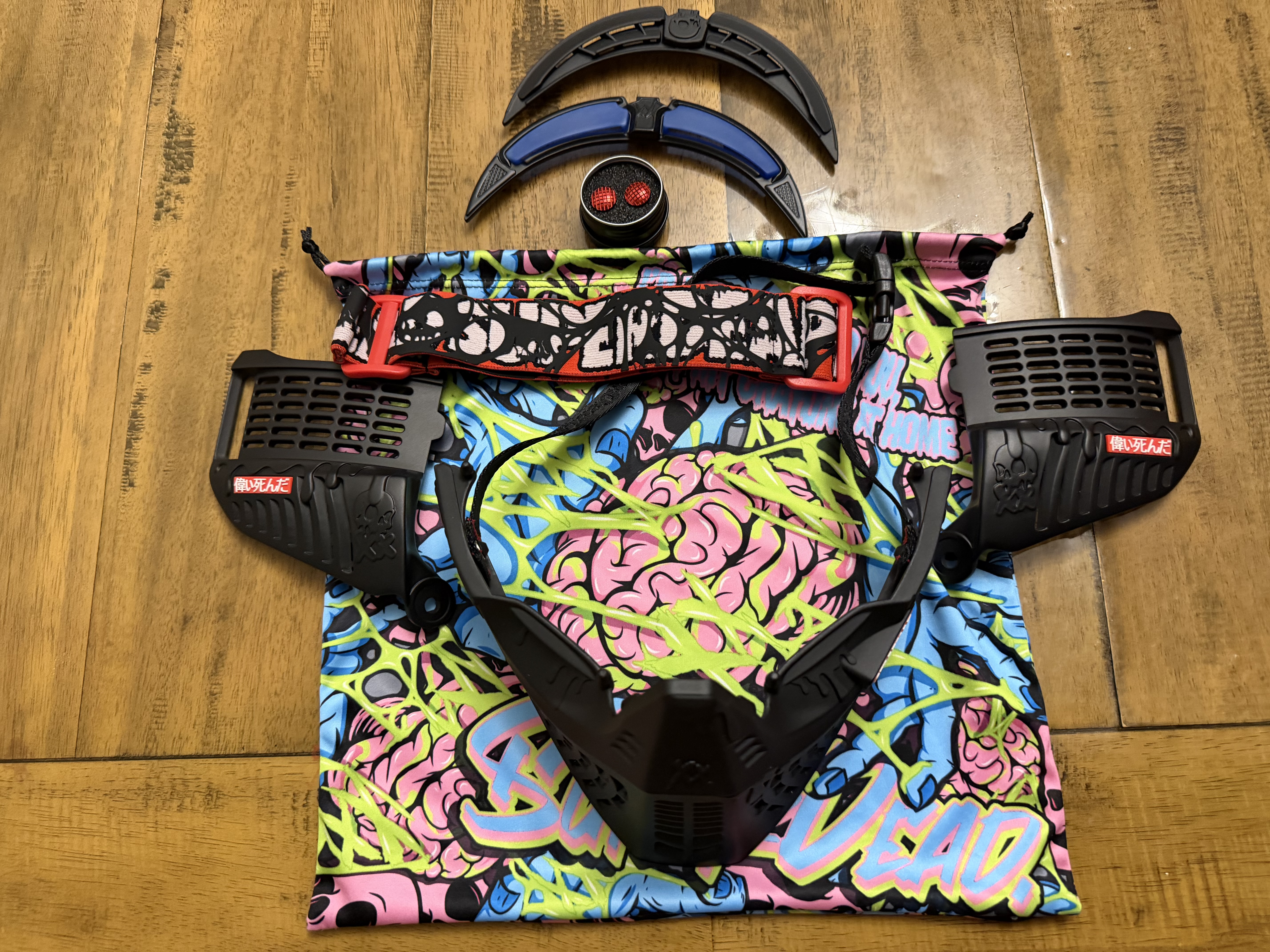 Black subrazed bottoms/ ears/ rain lid / strap. And biscuit red plugs