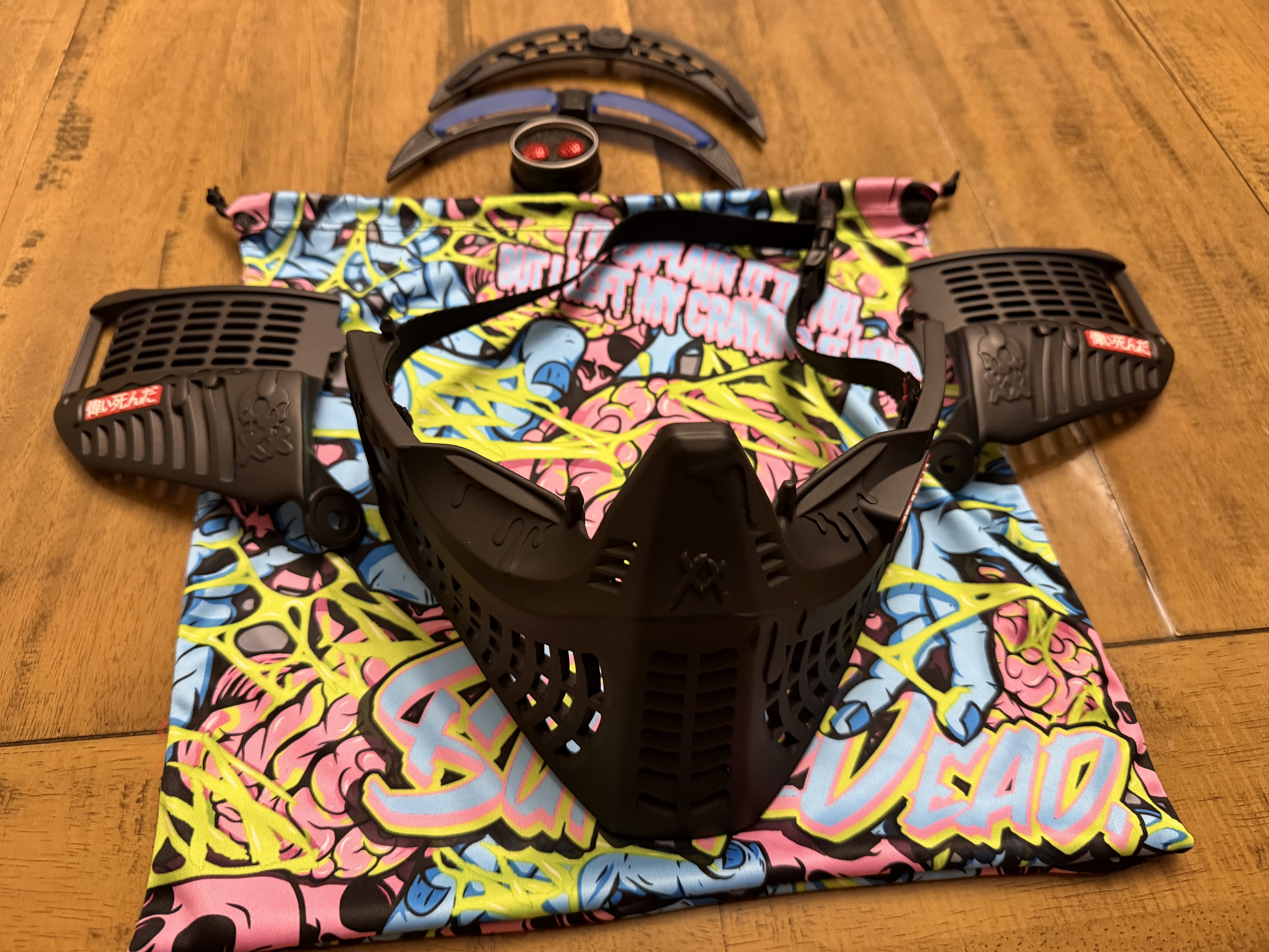 Black subrazed bottoms/ ears/ rain lid / strap. And biscuit red plugs
