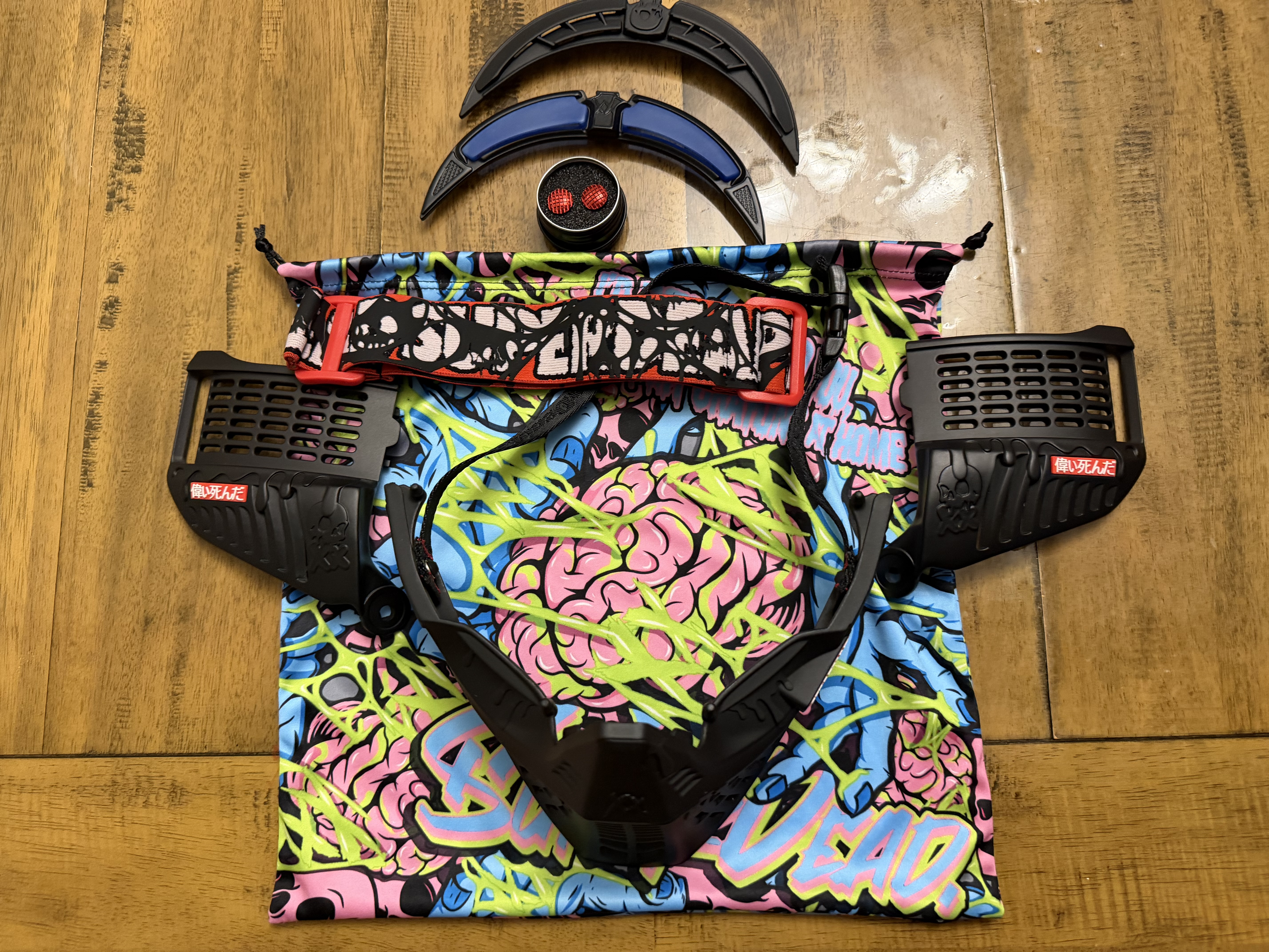 Black subrazed bottoms/ ears/ rain lid / strap. And biscuit red plugs