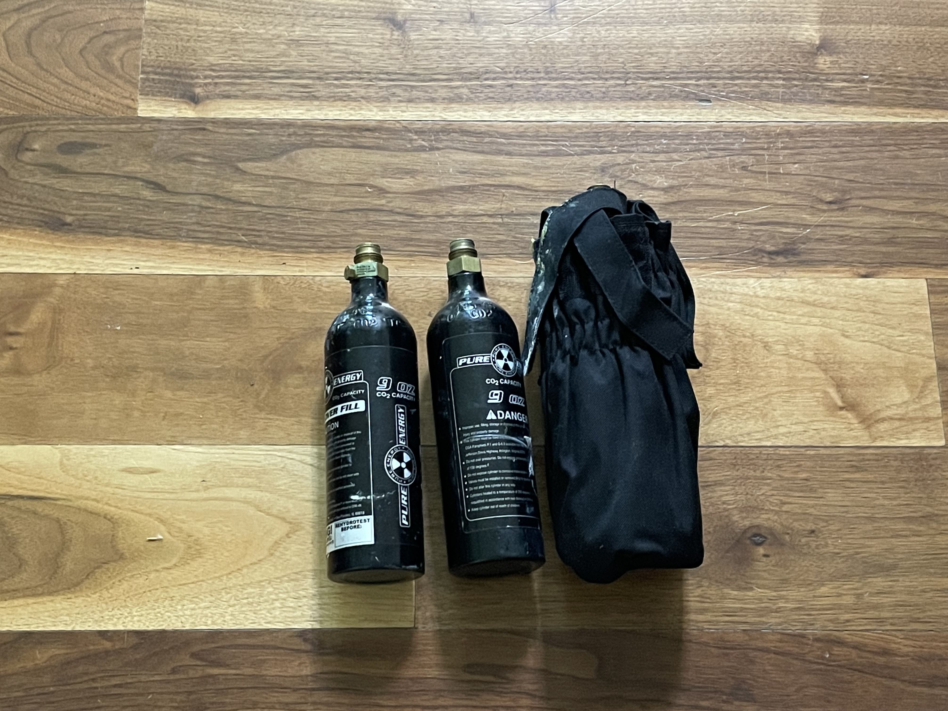 2 paintball markers including a Tippman custom pro and 3 co2 tanks and 2 loaders