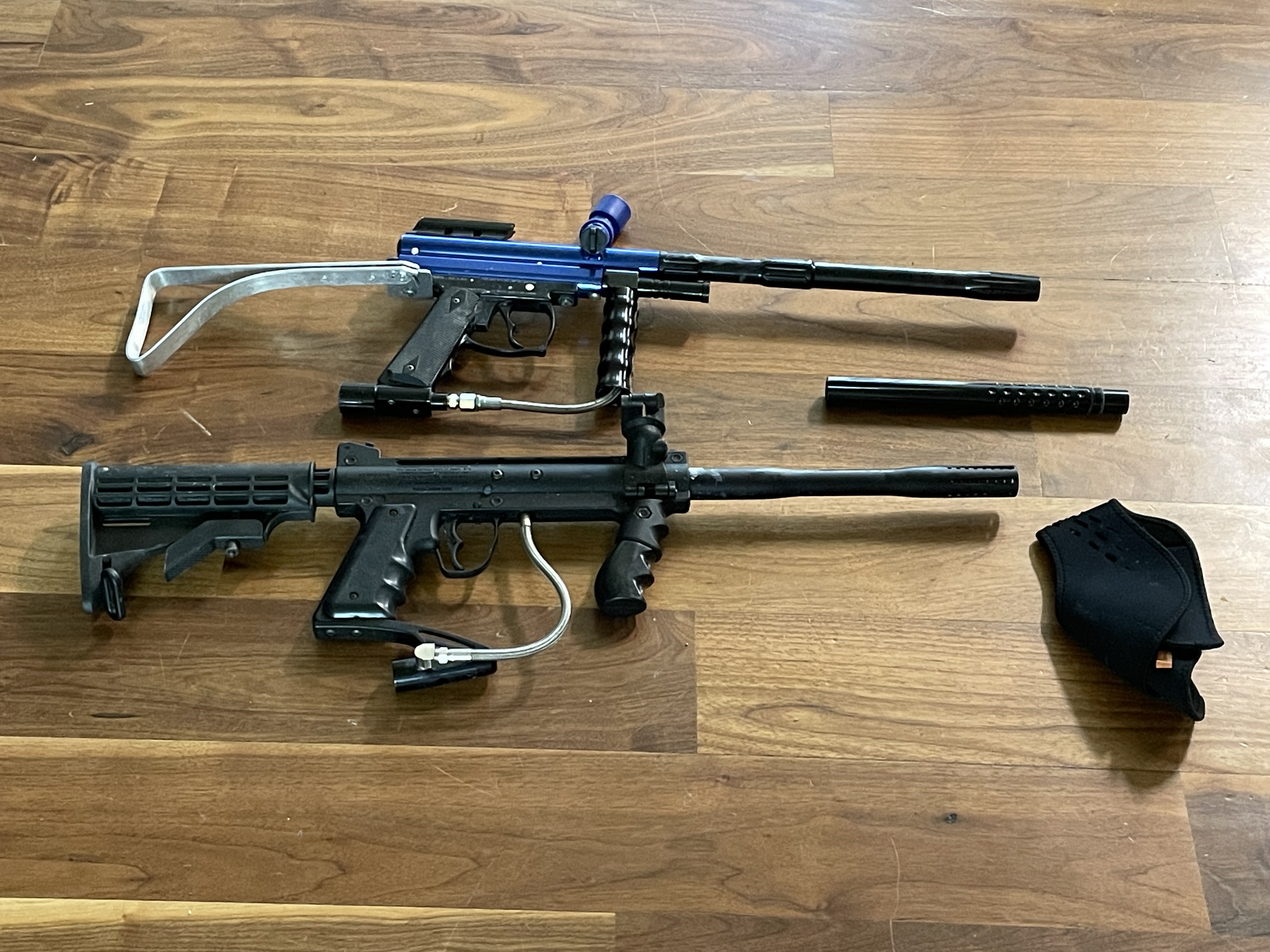 2 paintball markers including a Tippman custom pro and 3 co2 tanks and 2 loaders