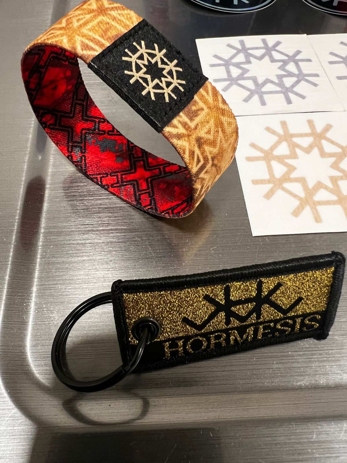 HIRMESIS LOT 13 Stickers, 2 MICRO FIBERS NEW, 1 GOLD KEYCHAIN, 1 REVERSIBLE WRIST BAND NEW! 
