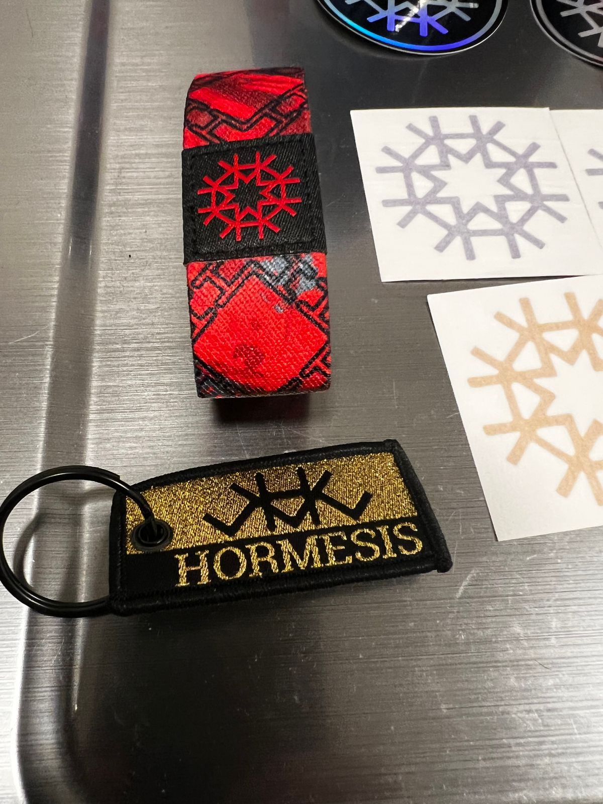 HIRMESIS LOT 13 Stickers, 2 MICRO FIBERS NEW, 1 GOLD KEYCHAIN, 1 REVERSIBLE WRIST BAND NEW! 