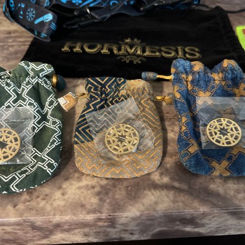 HORMESIS 7 wristbands, 1 black Velvet headband bag, 3 Hormesis pins & 3 Pouches, 1 Micro fiber. 