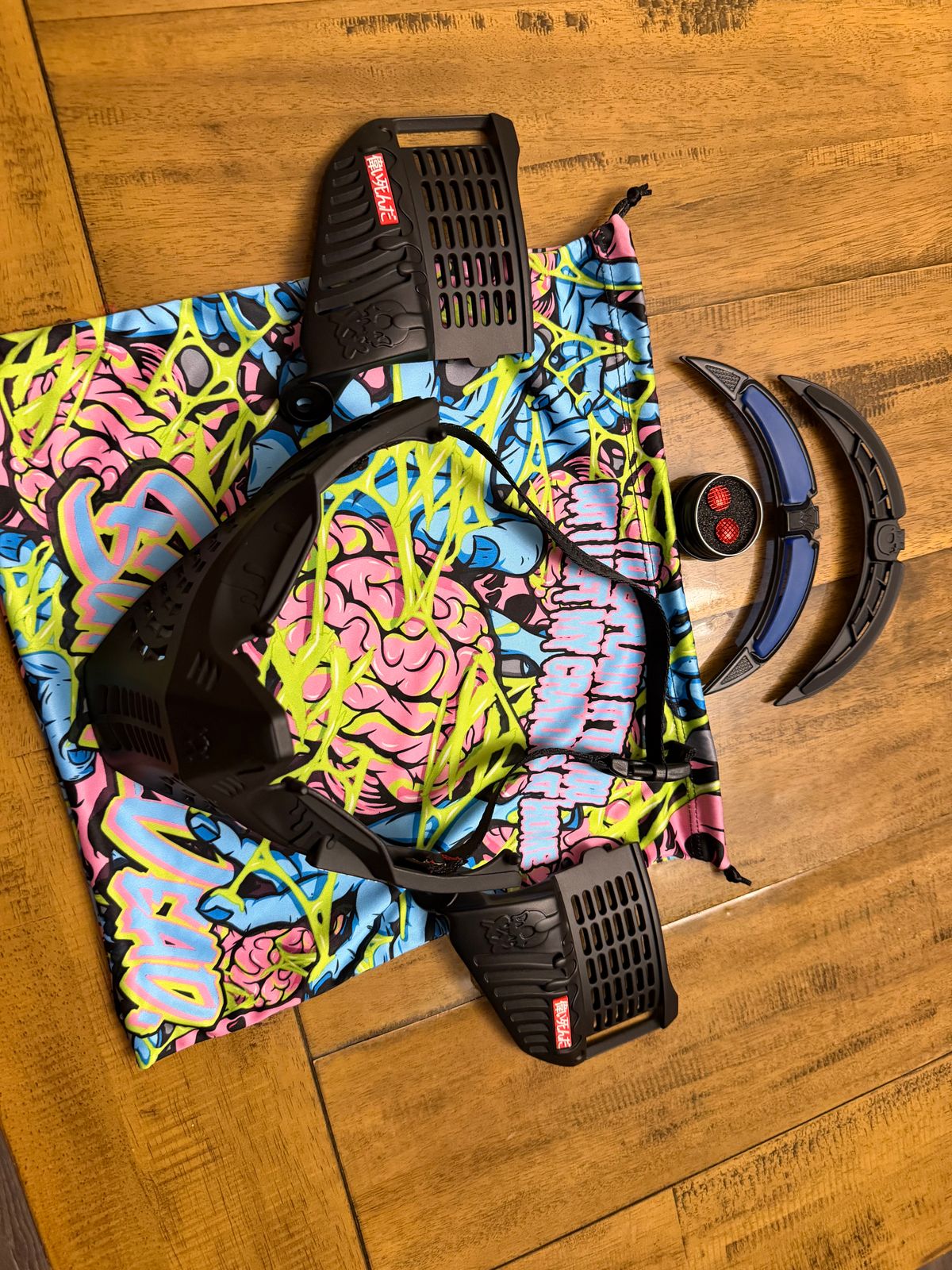 Black subrazed bottoms/ ears/ rain lid / strap. And biscuit red plugs
