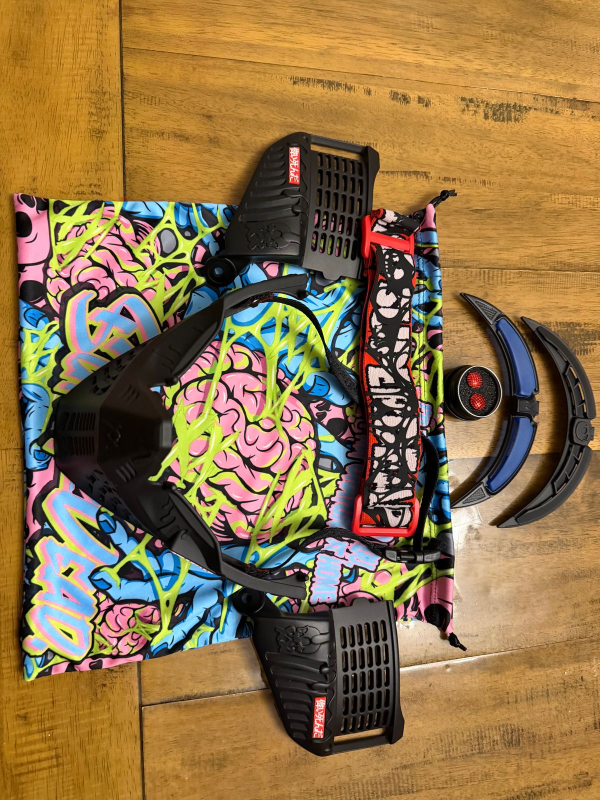 Black subrazed bottoms/ ears/ rain lid / strap. And biscuit red plugs