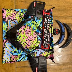 Black subrazed bottoms/ ears/ rain lid / strap. And biscuit red plugs