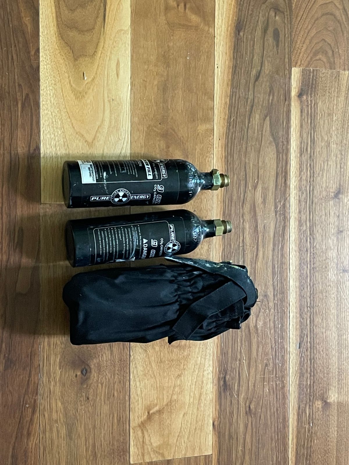 2 paintball markers including a Tippman custom pro and 3 co2 tanks and 2 loaders