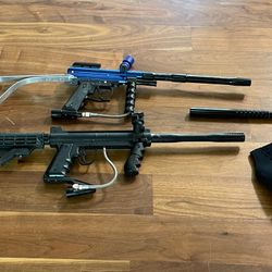2 paintball markers including a Tippman custom pro and 3 co2 tanks and 2 loaders